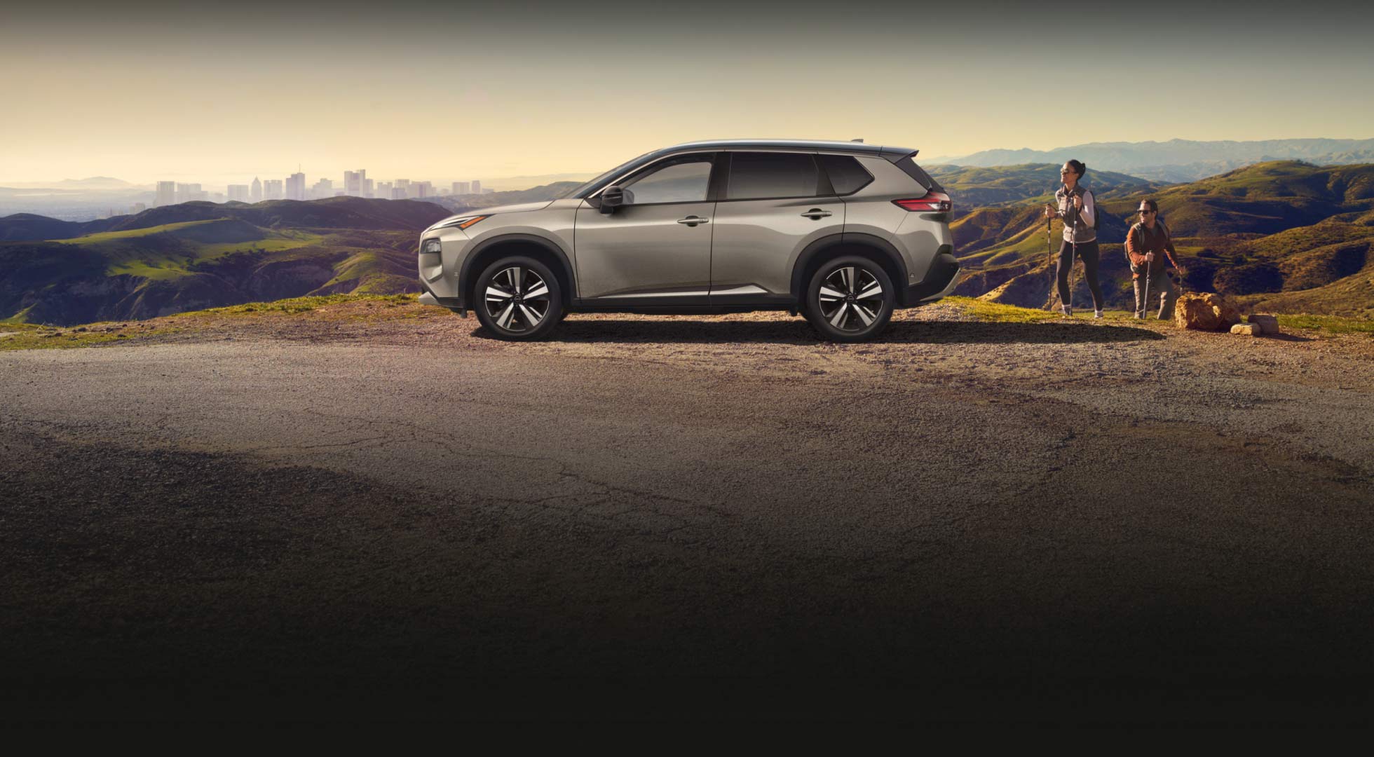 2023 Nissan Rogue in profile outdoors. 
