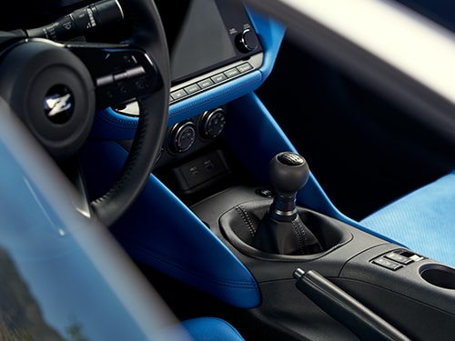 2024 Nissan Z blue interior showing manual transmission gear shifter